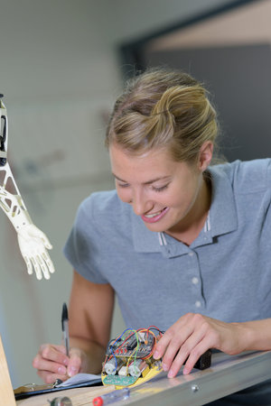 a female robotic electrician smiling