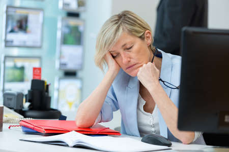 portrait of a sleepy businesswomanの写真素材