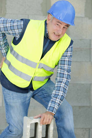 builder with back support belt protect postureの写真素材