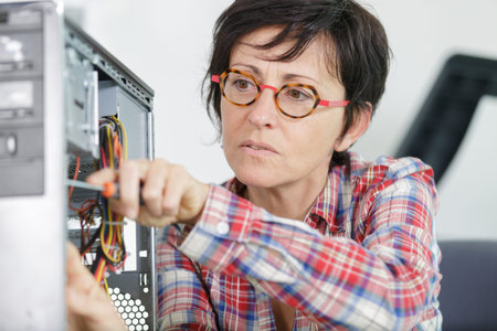 an engineer repairs a pc support