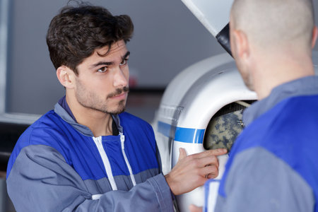 a young man fixing an aiplane