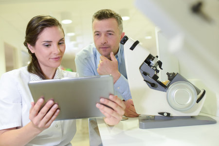a researchers looking at a tablet