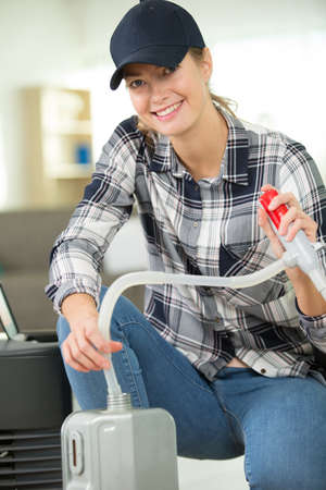 female mechanic looking at cameraの写真素材