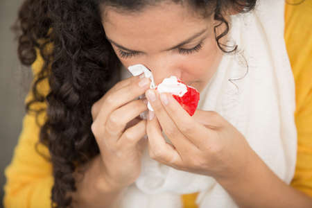woman bleeding from her noseの写真素材
