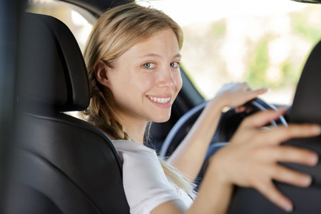 young female driving a car