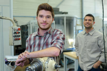 a portrait of apprentice on metalworking industryの写真素材