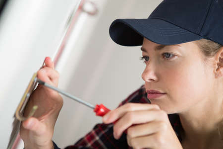 blonde handywoman holding boardsの写真素材