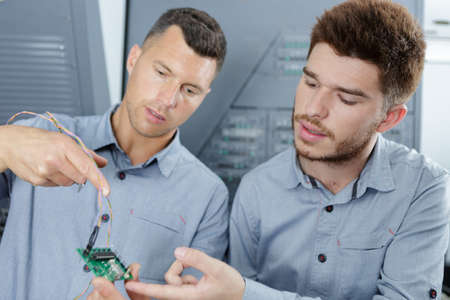 portrait of electronics technicians at workの写真素材