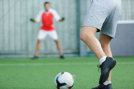 portrait of a soccer ball in goalの写真素材