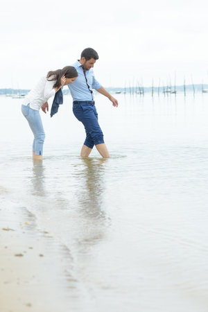 a couple playing in river