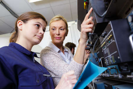 a female machine operating apprenticeの写真素材