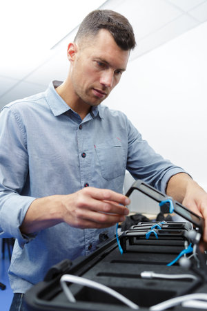 Factory chief engineer checking vr headset designs