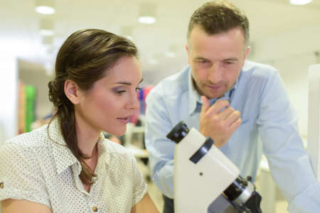 man and woman working in labの写真素材
