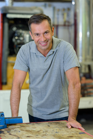 Happy worker at workshop