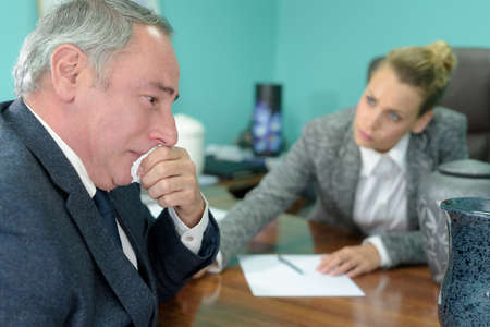 Man crying in the office of funeral home eの写真素材