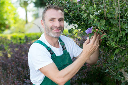 happy man gardening outsideの写真素材