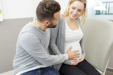 happy pregnant woman with  her husband
