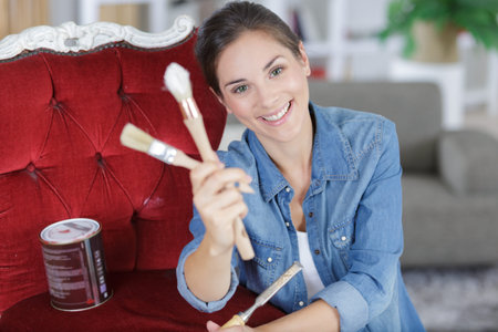 portrait of beautiful women holding brushes