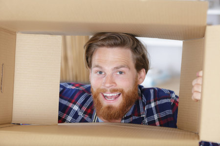 young man framing his face