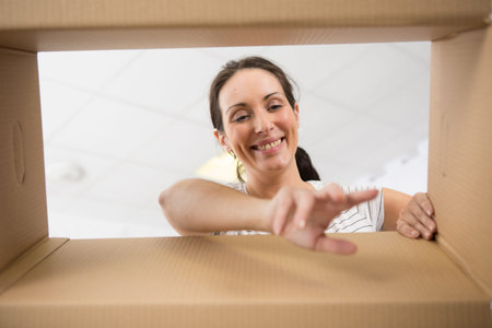 happy woman moving into her new home