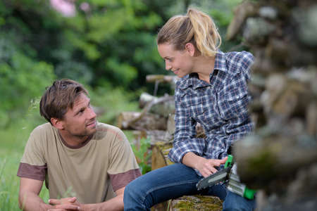 portrait of a couple loggers talkingの写真素材