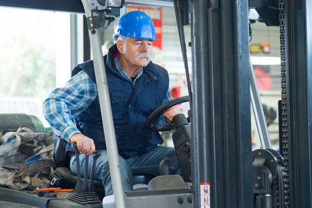 cheerful senior forklift operator