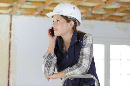 woman contractor worker with noise cancelling headphonesの写真素材