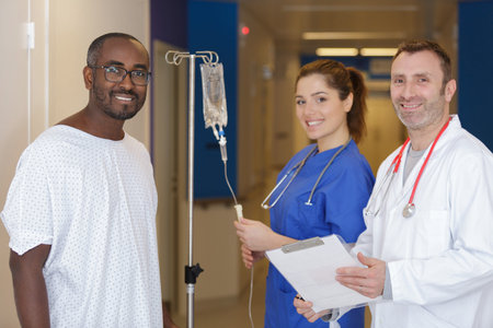 doctor talking to a patient in a hallway