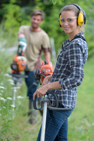 happy gardener couple in garden centerの写真素材