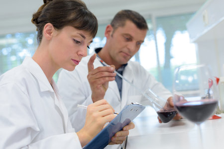 wine workers in biochemical laboratory