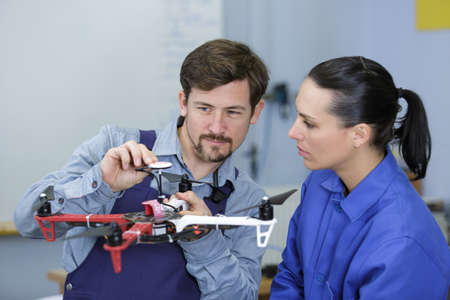 teal of technicians using a droneの写真素材