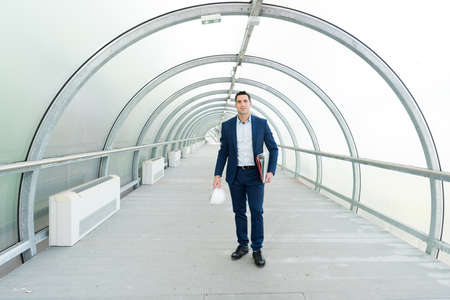 male engineer with safety white helmet in construction site buildingの写真素材