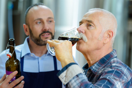 two brewers tasting beer at the brewery