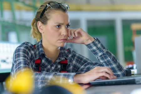 woman designer stressed out of work in selective focusの写真素材