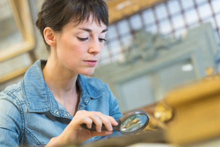portrait of woman with magnifying glassの写真素材