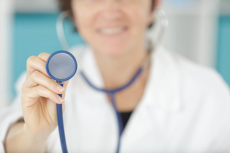 a female doctor using a stethoscope