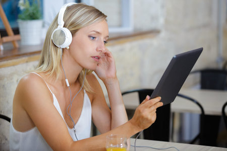 smiling young woman using a tabletの写真素材