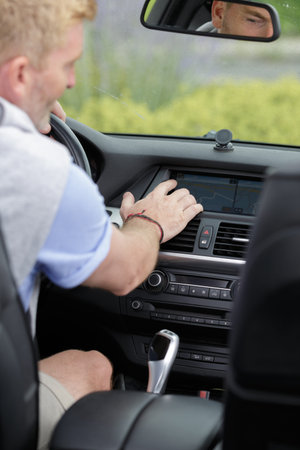 man driving car with navigation system