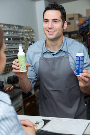 a male selling shoes productの写真素材