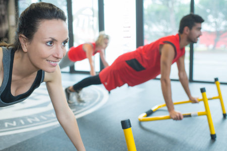 group at a gym doing push ups