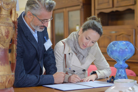 a businesswoman paying a furniture