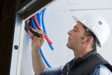 male electrician checks its serviceability