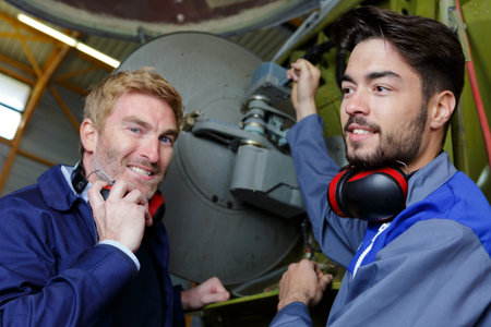 aviation mechanic with his apprentice