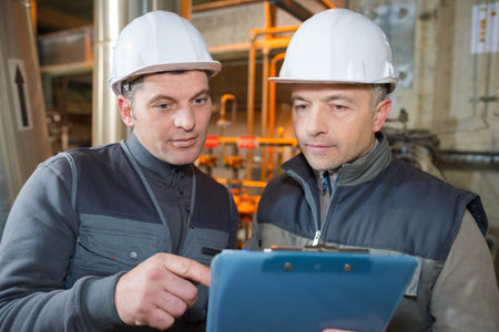 manual workers working with clipboard