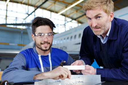 beaming workers having job at airdrome