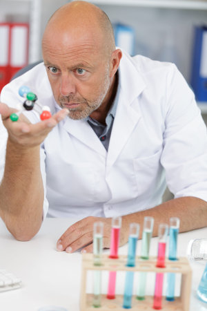 emotional scientist working in modern lab with a model
