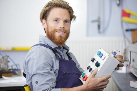 technician holding a control pad