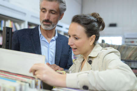 couple buying musicの写真素材