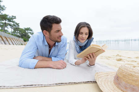 couple relaxing at the beachの写真素材