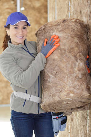 a female engineer working with insulationの写真素材